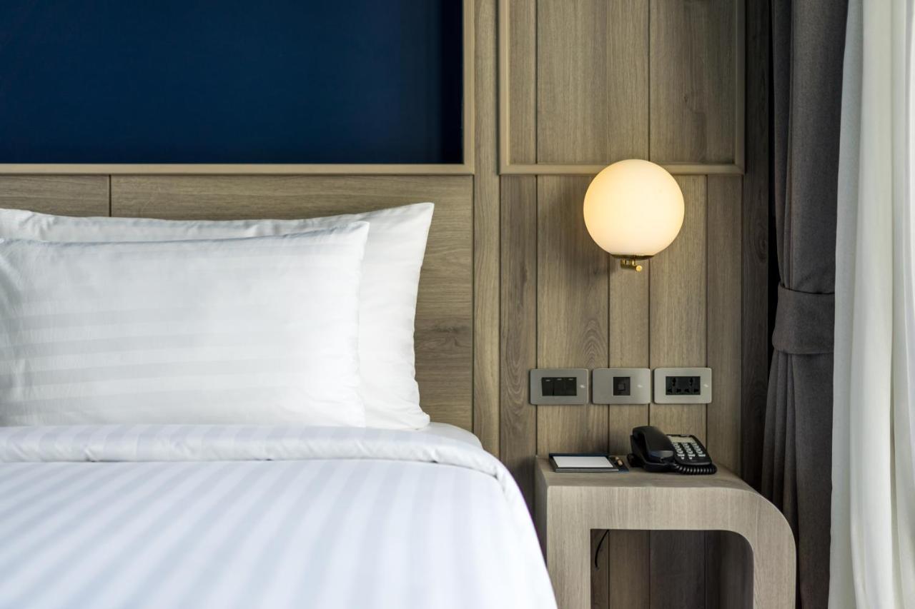 Seabed Grand Hotel Phuket - Sha Extra Plus Exterior photo A wall-mounted light